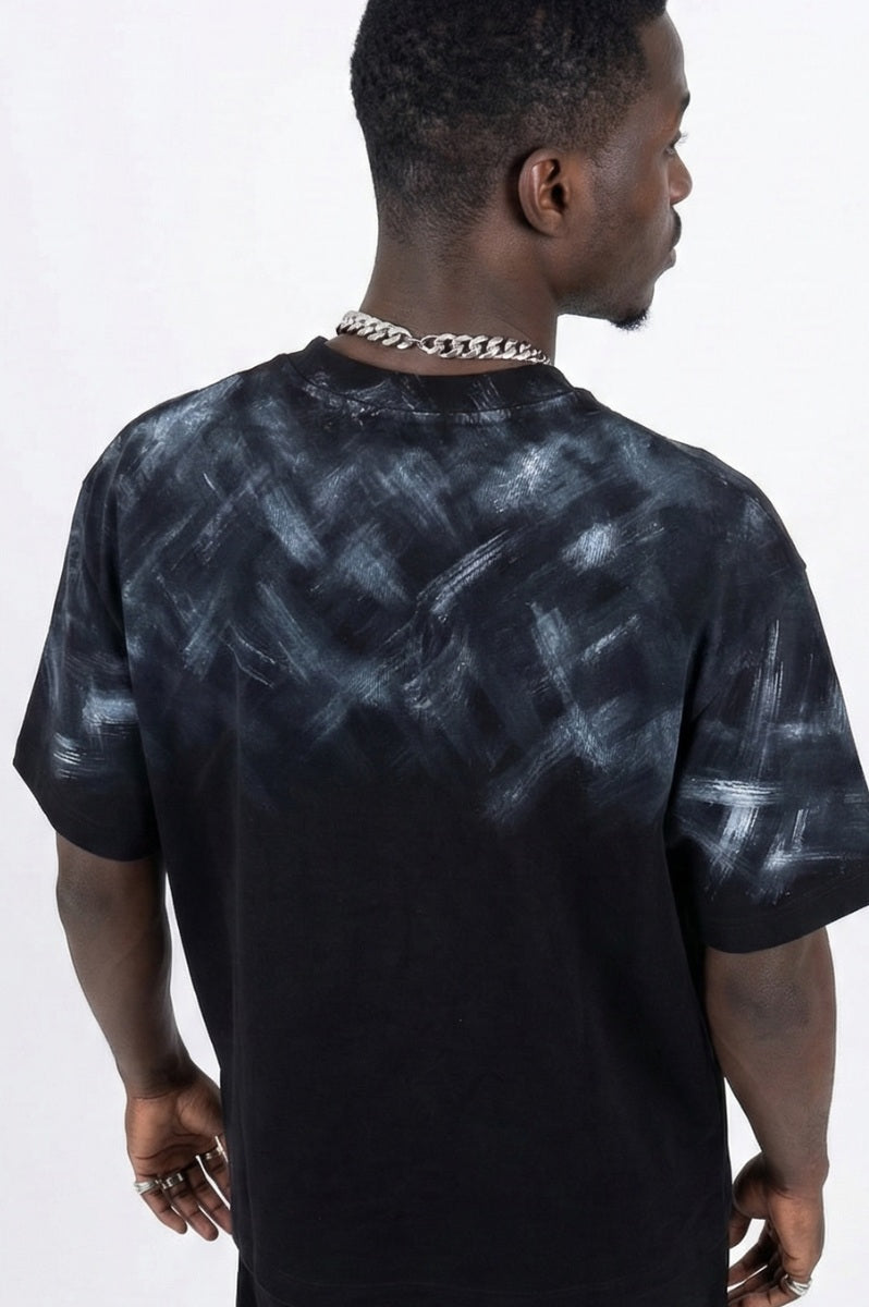 Man wearing a black t-shirt with 'FMC' logo and text on a white background